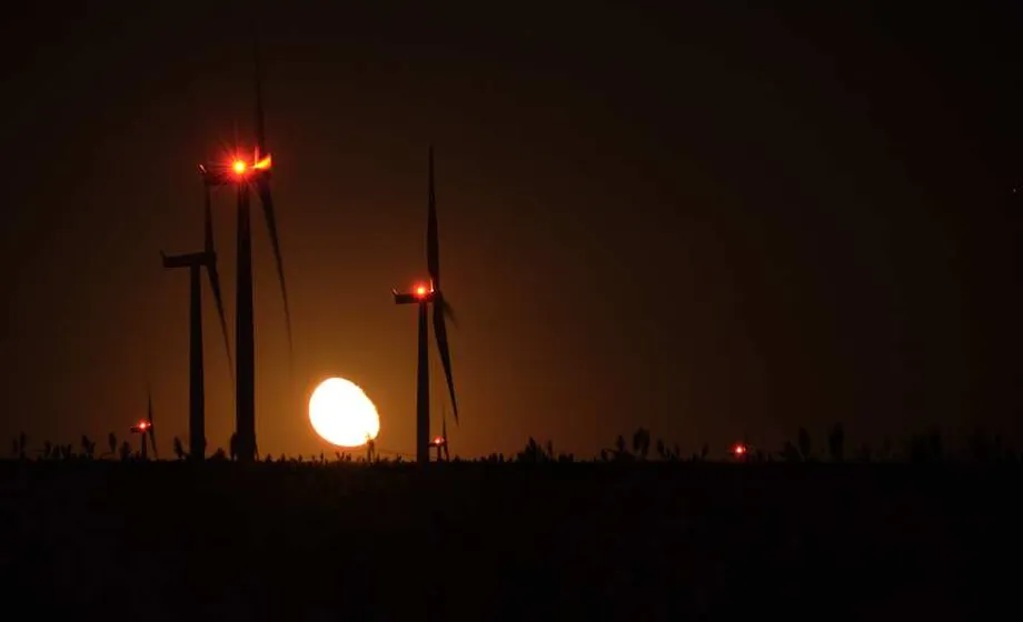 Wind turbines sunset landscape